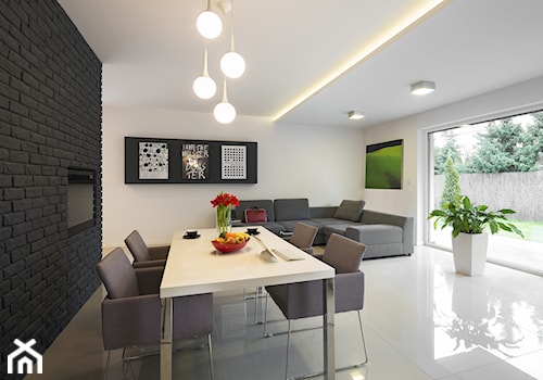 mieszkanie nowoczesne - Duży biały salon z jadalnią, styl nowoczesny - zdjęcie od StudioAtoato