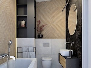 średnia łazienka z szarymi, czarnymi, drewnopodobnymi płytkami i dużym okrągłym lustrem - zdjęcie od JUKA design Pracownia Wnętrz
