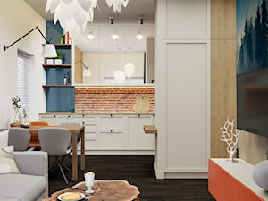 mały salon z aneksem kuchennym w kawalerce - zdjęcie od JUKA design Pracownia Wnętrz