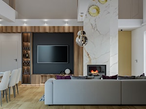 duży salon z antresolą i kominkiem - zdjęcie od JUKA design Pracownia Wnętrz