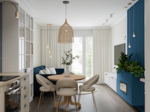 klasyczny salon z aneksem kuchennym w białym kolorze - zdjęcie od JUKA design Pracownia Wnętrz
