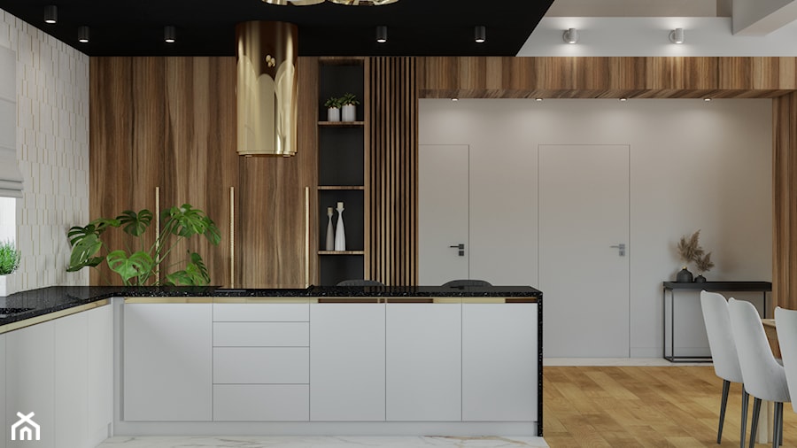 elegancka biała kuchnia z drewnem i złotym okapem - zdjęcie od JUKA design Pracownia Wnętrz