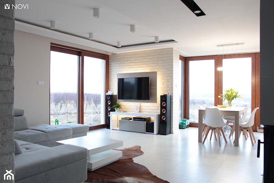 Salon z białą cegłą - zdjęcie od NOVI projektowanie