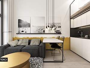 „MINImum powierzchni, MAXImum funkcjonalności” proj. WIKA ARCHITEKCI - Mały biały żółty salon z kuchnią z jadalnią, styl nowoczesny - zdjęcie od WIKA ARCHITEKCI