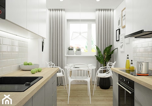 Remont mieszkania pod inwestycję - Mała zamknięta biała z zabudowaną lodówką z nablatowym zlewozmywakiem kuchnia dwurzędowa z oknem, styl skandynawski - zdjęcie od Wnętrza od NOWA