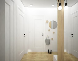 Remont mieszkania pod inwestycję - Średni z wieszakiem biały szary hol / przedpokój, styl skandynaw ... - zdjęcie od Wnętrza od NOWA - Homebook