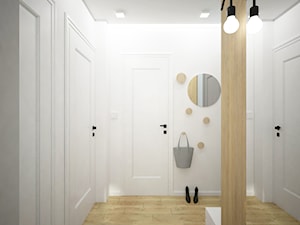 Remont mieszkania pod inwestycję - Średni z wieszakiem biały szary hol / przedpokój, styl skandynawski - zdjęcie od Wnętrza od NOWA