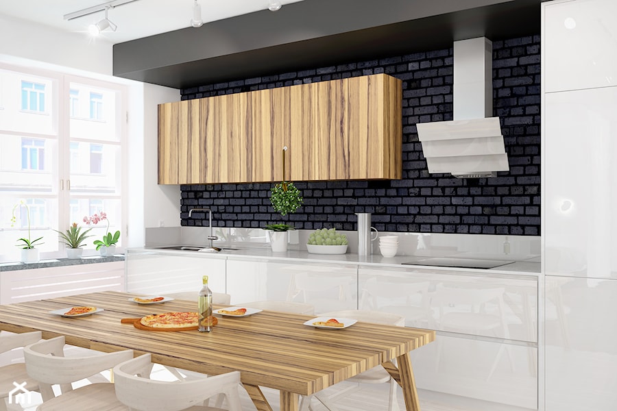 Minimalistyczna zabudowa kuchenna wraz ze szklanym okapem Divergo White, połączona z jadalnią - zdjęcie od GLOBALO.PL - Ciche i wydajne okapy kuchenne