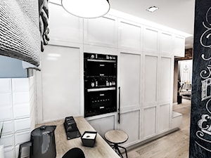 Projekt mieszkania w Łodzi 65 m2 - Otwarta z zabudowaną lodówką kuchnia, styl skandynawski - zdjęcie od BIBI
