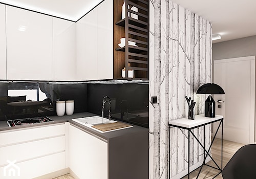 Projekt mieszkania - Austria 2017 - Mała otwarta z kamiennym blatem czarna z zabudowaną lodówką z nablatowym zlewozmywakiem kuchnia w kształcie litery l - zdjęcie od BIBI Designe