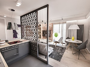 Projekt mieszkania 60 m2 w Gdańsku - Mały szary salon z kuchnią z jadalnią z bibiloteczką, styl skandynawski - zdjęcie od BIBI Designe