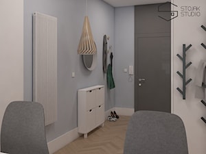 Niewielkie mieszkania na wynajem - Średni z wieszakiem czarny szary hol / przedpokój, styl skandynawski - zdjęcie od Stojak Studio