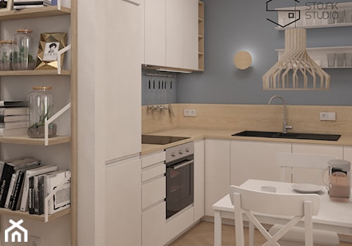 Niewielkie mieszkania na wynajem - Mała otwarta szara z zabudowaną lodówką z nablatowym zlewozmywakiem kuchnia w kształcie litery l, styl skandynawski - zdjęcie od Stojak Studio