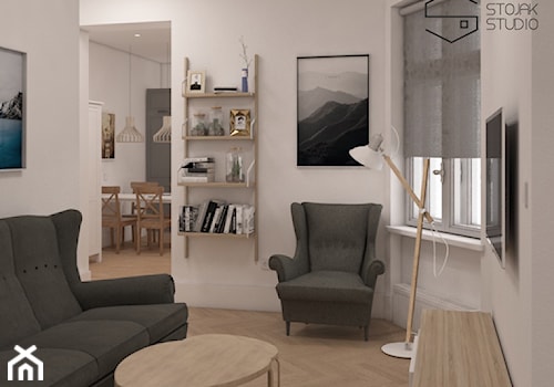 Niewielkie mieszkania na wynajem - Mały biały salon, styl skandynawski - zdjęcie od Stojak Studio