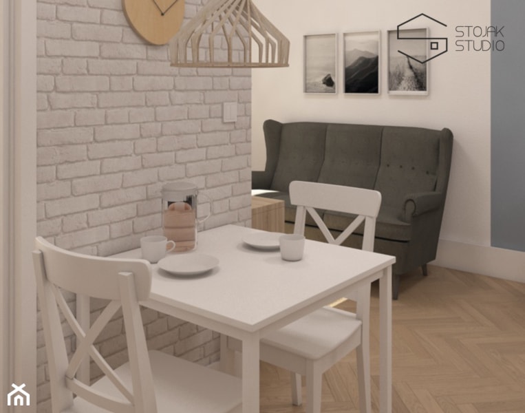 Niewielkie mieszkania na wynajem - Mała biała szara jadalnia w salonie, styl skandynawski - zdjęcie od Stojak Studio