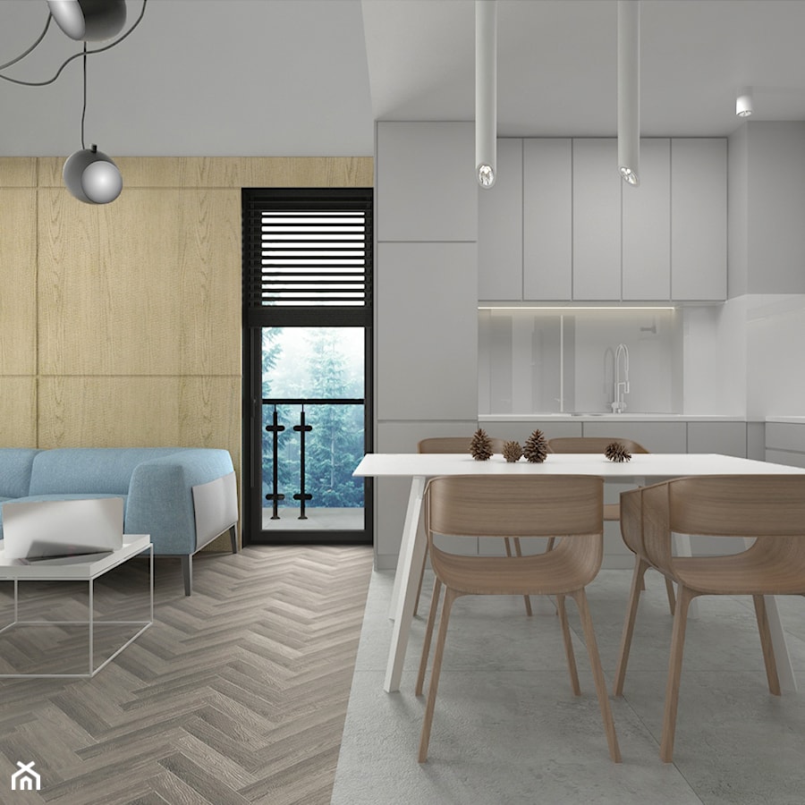 Mieszkania dla pary - Mała otwarta z salonem biała szara kuchnia w kształcie litery l z oknem z kompozytem na ścianie nad blatem kuchennym, styl minimalistyczny - zdjęcie od mkosiorowska