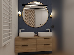Praktyczna łazienka  z wanną i prysznicem w jasnych barwach z akcentami