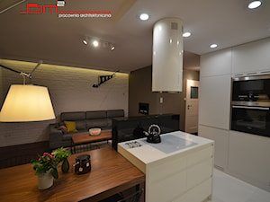projekt mieszkania 65m2 - Średnia otwarta z zabudowaną lodówką kuchnia z wyspą lub półwyspem, styl nowoczesny - zdjęcie od bm2 brzostek maciej