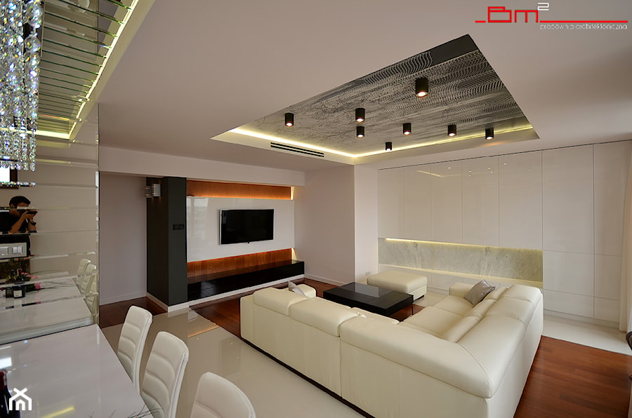apartament 140m2 - Duży biały salon z kuchnią z jadalnią, styl minimalistyczny - zdjęcie od bm2 brzostek maciej