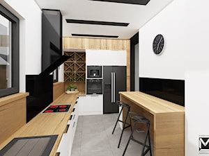 Projekt pomieszczeń wspólnych w domu jednorodzinnym - Duża zamknięta biała czarna z zabudowaną lodówką z nablatowym zlewozmywakiem kuchnia w kształcie litery l z oknem, styl nowoczesny - zdjęcie od jaminska.pl