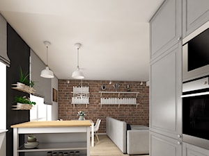 Dom w Chwaszczynie - Średnia biała czarna jadalnia w salonie w kuchni - zdjęcie od Pracownia Projektowa Decoretti - Agata Jachimowicz