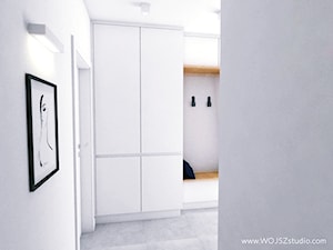 Mieszkanie w Gdyni · Projekt - Średni z wieszakiem biały szary hol / przedpokój, styl minimalistyczny - zdjęcie od WOJSZ studio