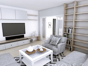 Mieszkanie w Gdańsku · Projekt - Mały biały szary salon z bibiloteczką, styl skandynawski - zdjęcie od WOJSZ studio