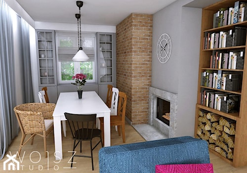 Dom w Różynach · Projekt - Mały szary salon z jadalnią z bibiloteczką, styl rustykalny - zdjęcie od WOJSZ studio