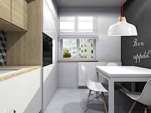 Mieszkanie w Gliwicach.Kuchnia z łazienką - Mała biała czarna jadalnia w kuchni, styl nowoczesny - zdjęcie od STUDIO PNIAK