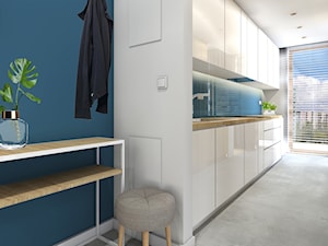 70m2 w Krakowie wersja 2 - Średnia z salonem niebieska z zabudowaną lodówką z podblatowym zlewozmywakiem kuchnia jednorzędowa z oknem, styl nowoczesny - zdjęcie od STUDIO PNIAK