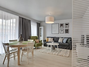 Apartament do wynajęcia Gdańsk - Duży szary salon z jadalnią, styl skandynawski - zdjęcie od Vprojekt design by Weronika