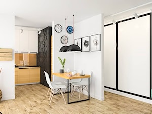 50 m2 - Duża biała jadalnia w salonie - zdjęcie od Sylwia Drążczyk