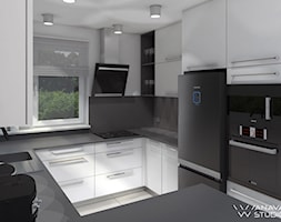 Kuchnia New - Mała otwarta biała czarna z zabudowaną lodówką z podblatowym zlewozmywakiem kuchnia w ... - zdjęcie od Anava Studio - Homebook