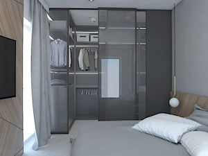 Z betonem w tle - Mała szara sypialnia z garderobą, styl nowoczesny - zdjęcie od Studio projektowania wnętrz''Studio Aranżacji''