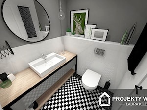 Łazienka z czarno-białą podłogą