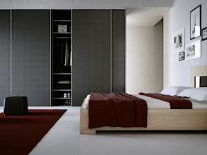 Komandor – Sypialnia z łóżkiem, szafkami nocnymi oraz szafą z drzwiami przesuwnymi - zdjęcie od Komandor - Wnętrza z Charakterem