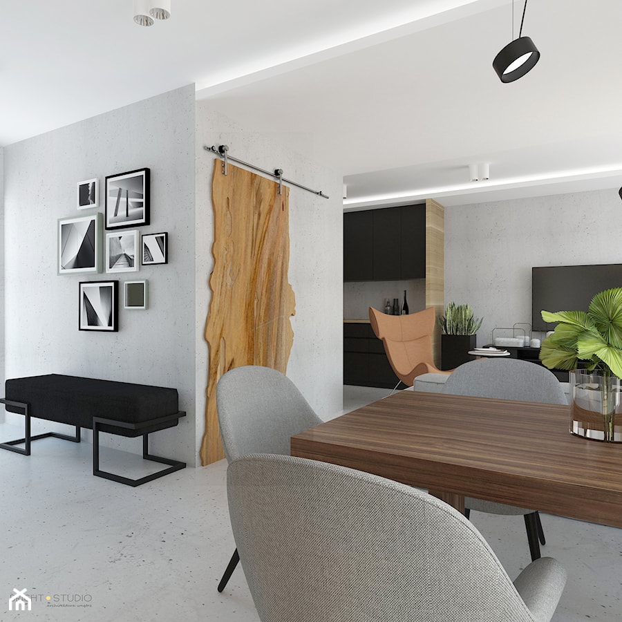 Projekt mieszkania w stylu Loftowym - Mały szary salon z jadalnią, styl industrialny - zdjęcie od BRight Studio