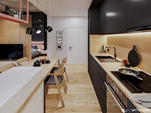 REJTANA - Średnia otwarta z salonem z kamiennym blatem biała czarna z zabudowaną lodówką z nablatowym zlewozmywakiem kuchnia dwurzędowa, styl nowoczesny - zdjęcie od ARCHIWYTWÓRNIA Tomek Pytel