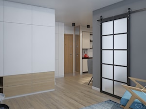 Dwa pokoje - Średni biały szary salon z kuchnią z jadalnią, styl industrialny - zdjęcie od Szkic Design - Projektowanie wnętrz