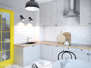 Mieszkanie z żółtymi drzwiami - Średnia otwarta biała szara z zabudowaną lodówką z podblatowym zlewozmywakiem kuchnia w kształcie litery l, styl skandynawski - zdjęcie od Szkic Design - Projektowanie wnętrz