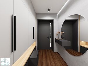 dom w Łodzi - Młoda rodzinka 2+2 (2021) - Średni z zabudową meblową z okrągłym lustrem biały szary z lustrem na ścianie z farbą na ścianie z drzwiami bezprzylgowymi z przeszklonymi drzwiami z gładkimi drzwiami hol / przedpokój, styl nowoczesny - zdjęcie od AQ Design