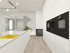 Rzeszów - D23 - Projekt domu jednorodzinnego 600 m2 - Duża otwarta biała z zabudowaną lodówką z podblatowym zlewozmywakiem kuchnia dwurzędowa z oknem, styl nowoczesny - zdjęcie od BAGUA Pracownia Architektury Wnętrz