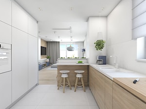 (Pruszków) Projekt mieszkania 3 - Średnia otwarta biała z zabudowaną lodówką z podblatowym zlewozmywakiem kuchnia w kształcie litery u z kompozytem na ścianie nad blatem kuchennym, styl nowoczesny - zdjęcie od BAGUA Pracownia Architektury Wnętrz