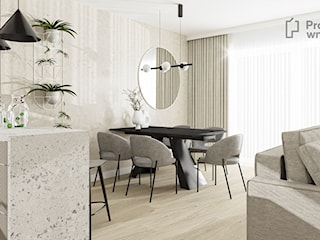 Duży salon z kuchnią jadalnią kominkiem japandi nowoczesny minimalistyczny