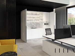 Projekt wnętrza biura - Duże z sofą z zabudowanym biurkiem białe czarne biuro, styl nowoczesny - zdjęcie od LIBRA Architekci