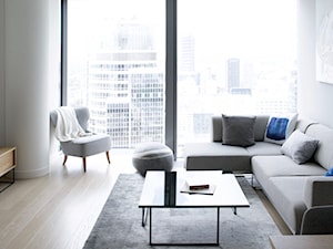 110 m nad poziomem miasta - Mały biały salon, styl minimalistyczny - zdjęcie od KANDO ARCHITECTS