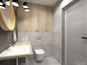 łazienka w betonach i szarościach - Mała na poddaszu bez okna z lustrem łazienka, styl nowoczesny - zdjęcie od Strzelecka Design