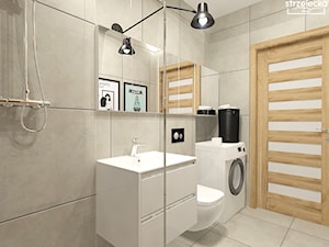 Łazienka w neutralnym wykończeniu - Mała bez okna z pralką / suszarką z lustrem łazienka, styl nowoczesny - zdjęcie od Strzelecka Design