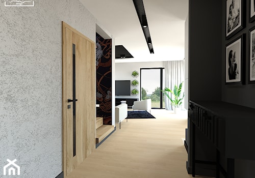 Parter domu w industrialno-loftowym wykończeniu - Średni czarny szary z farbą na ścianie z drzwiami ... - zdjęcie od Strzelecka Design