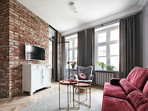 Apartament do wynajęcia z różowymi akcentami. - Mały szary salon, styl nowoczesny - zdjęcie od double look design